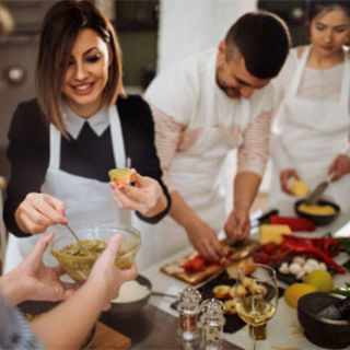 People smiling in a cooking class