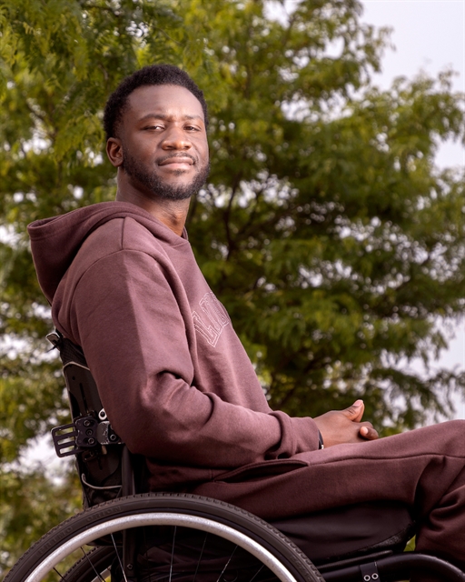 portrait of otis young seated in a wheelchair