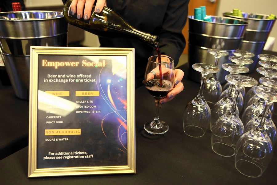 Wine being poured at the Empower Social
