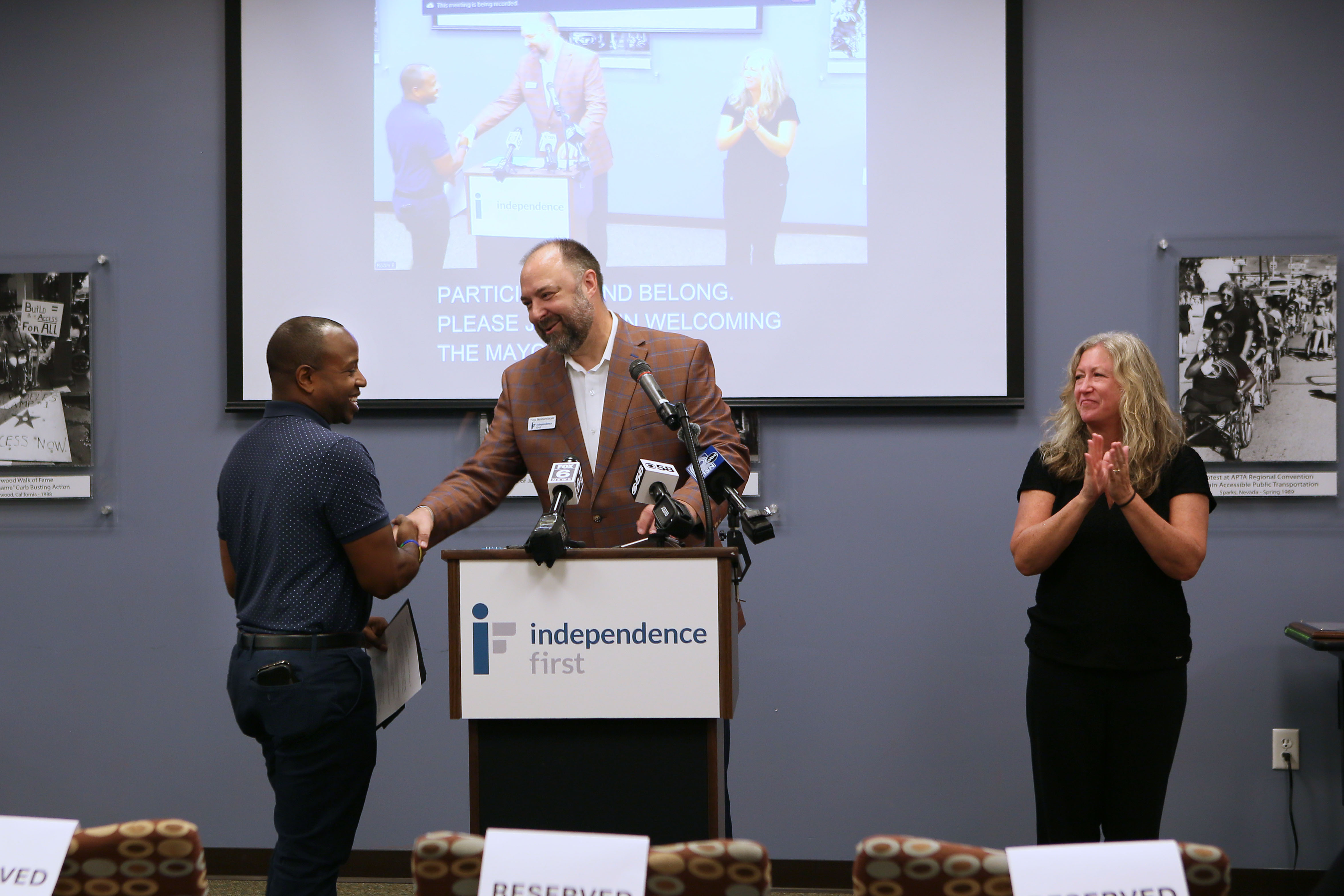Milwaukee Mayor Cavalier Johnson shakes hands with Independence First Fund Development Director Troy Moldenhauer
