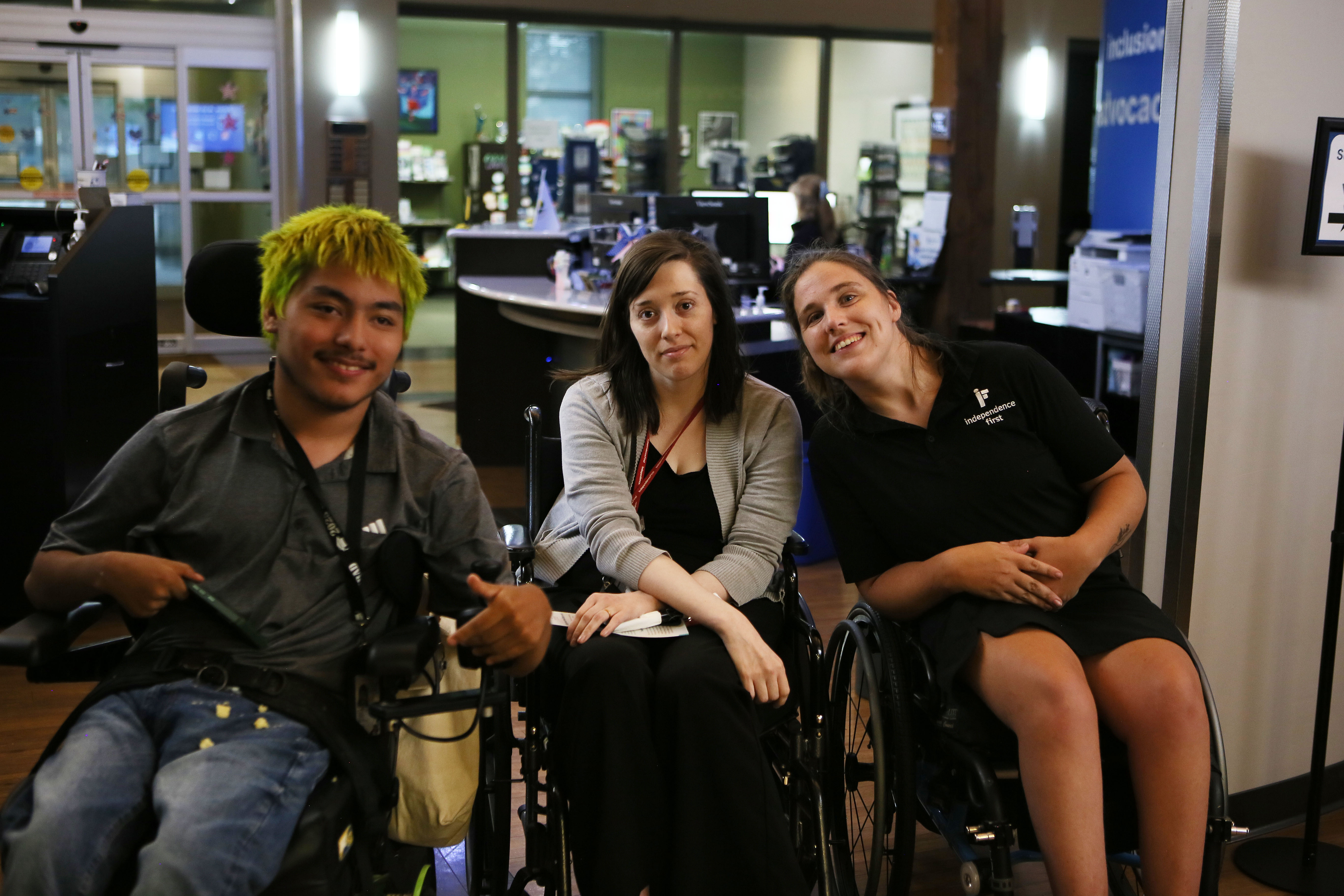 Attendees and Independence First Staff pose for a picture, smiling