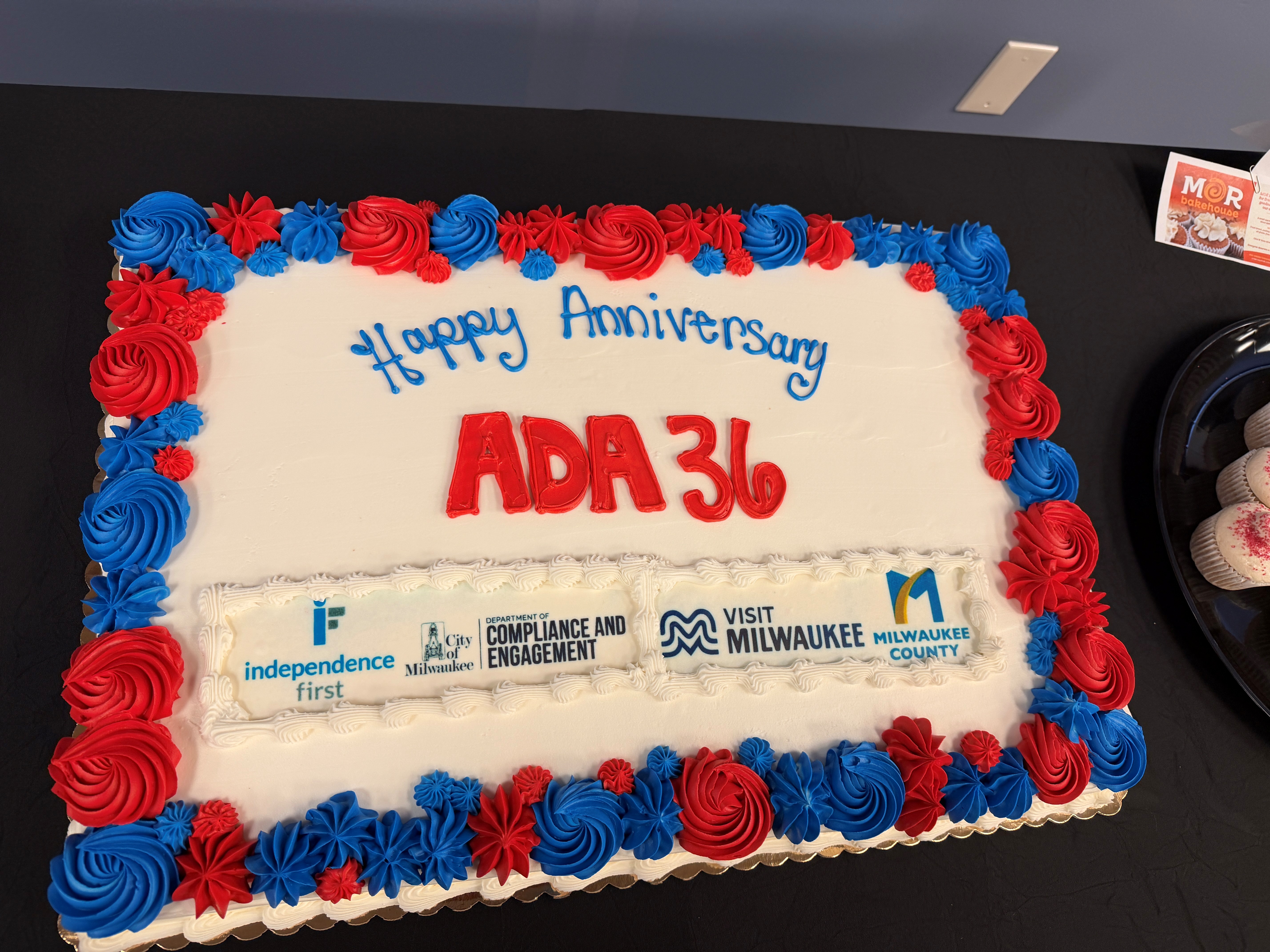 A large rectangular sheet cake celebrates the 36th anniversary of the Americans with Disabilities Act.