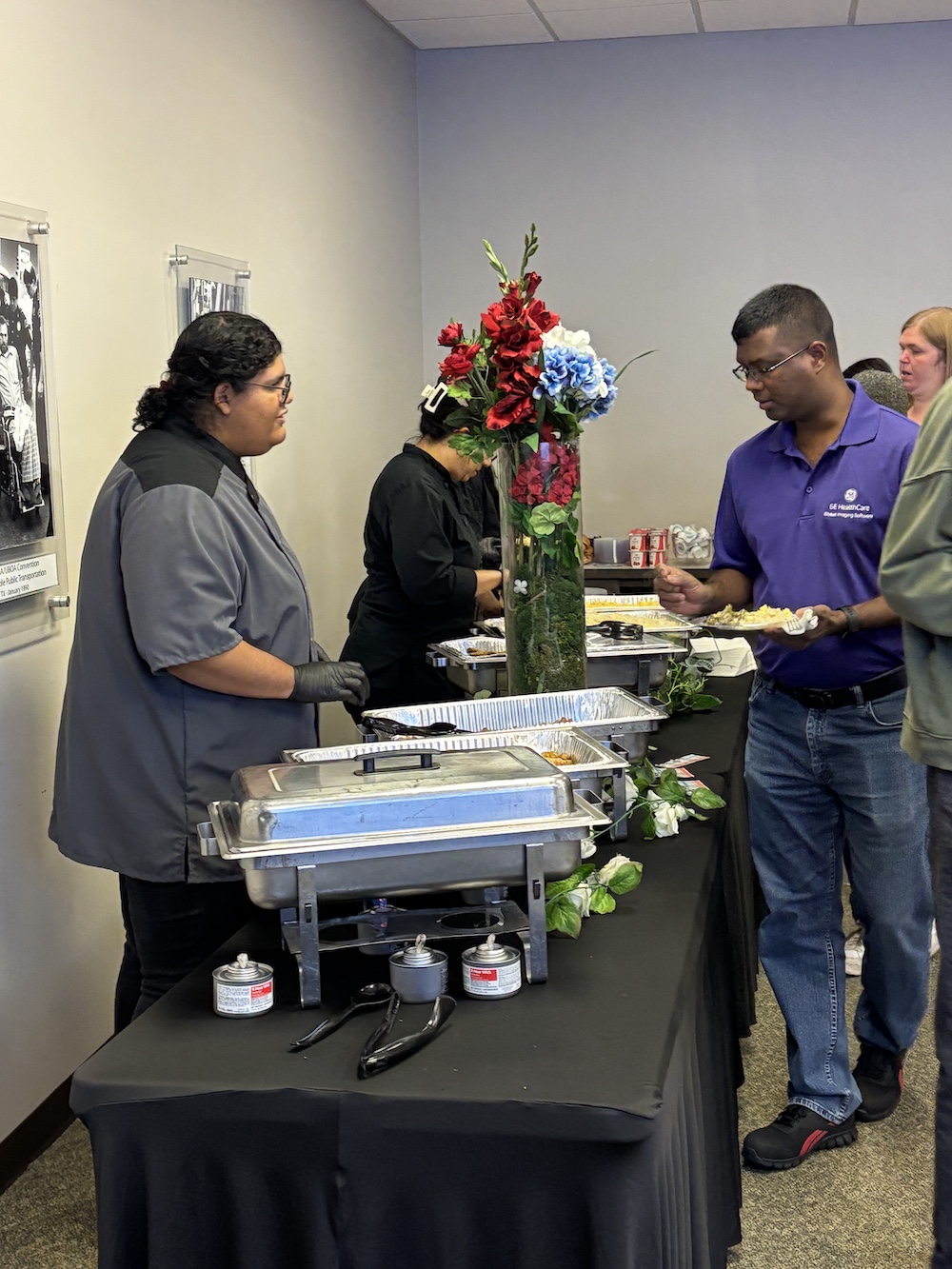 A caterer serves breakfast to an event attendee
