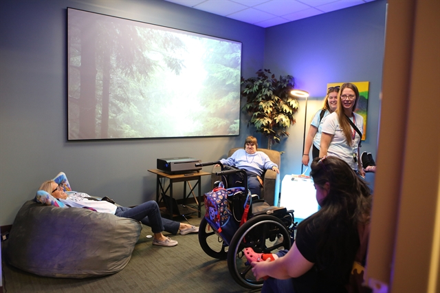 Event attendees testing out the new sensory room
