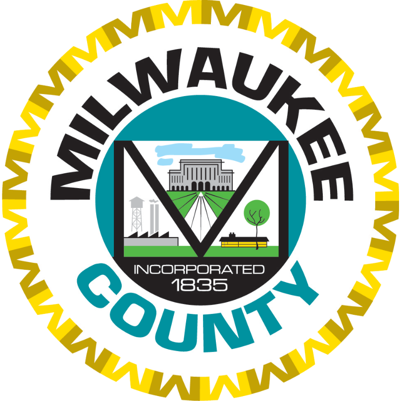 Circular seal of Milwaukee County. The outer ring features a gold sunburst border with "MILWAUKEE" i