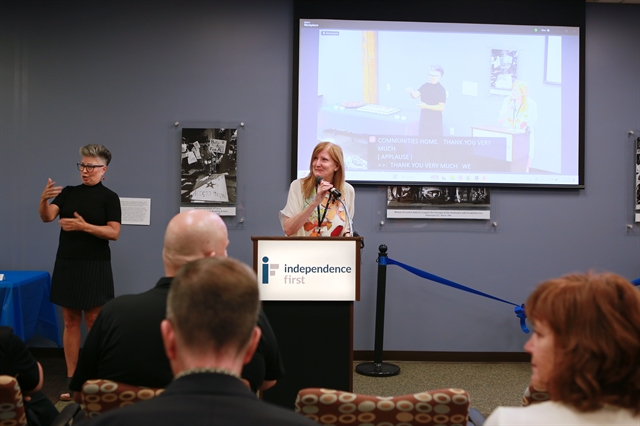 Photo of Independence First CEO and President Marci Boucher speaking to the crowd.