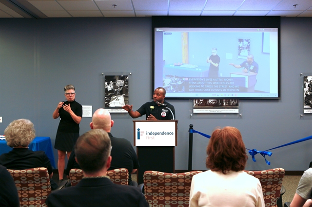 Photo of Mayor Cavalier Johnson giving a speech with an ASL interpreter to his side