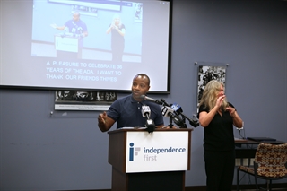 Milwaukee Mayor Cavalier Johnson speaks at the podium during Independence First's celebration of the 36th anniversary of the Americans with Disabilities Act.