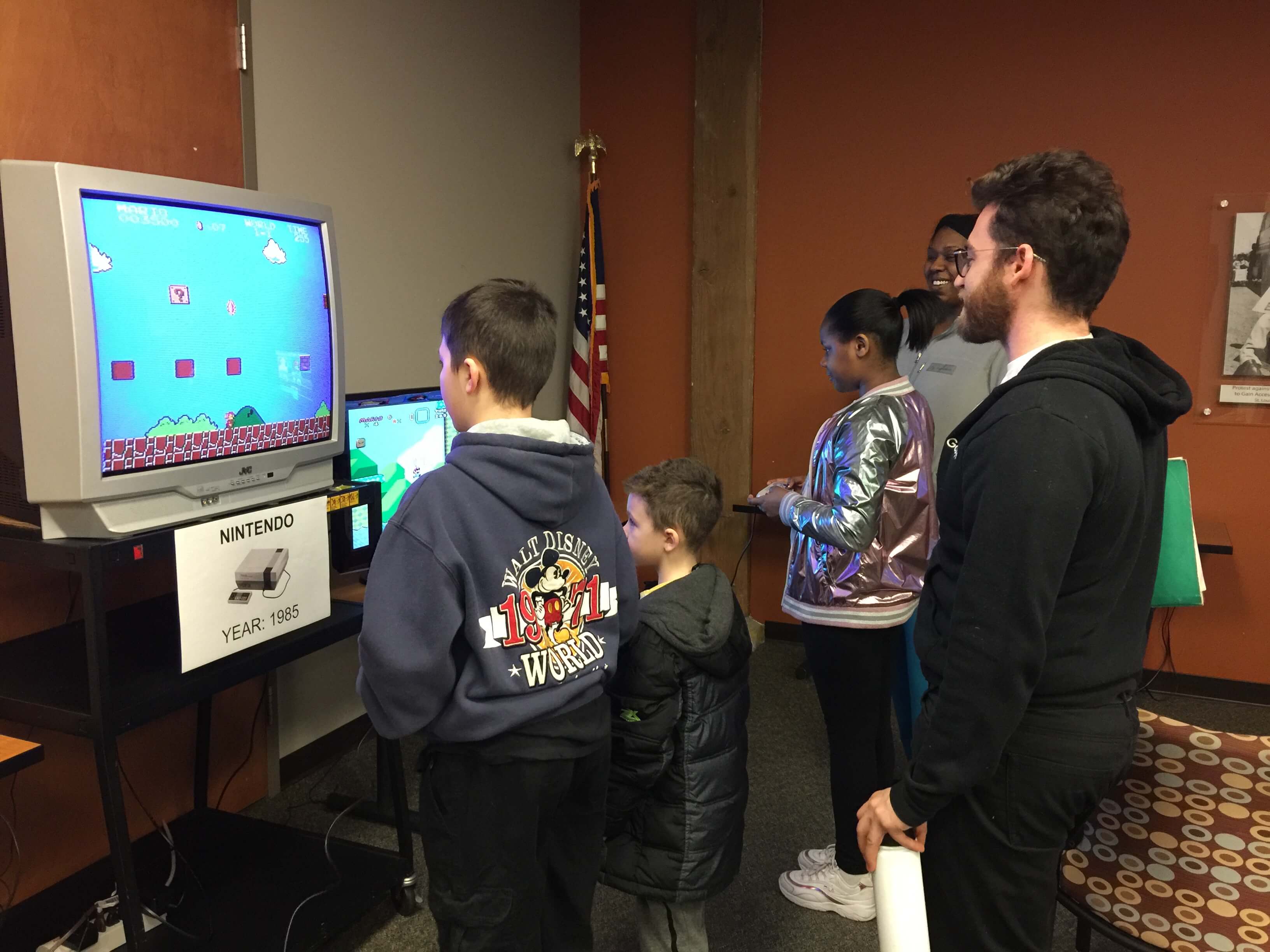 three kids playing video games