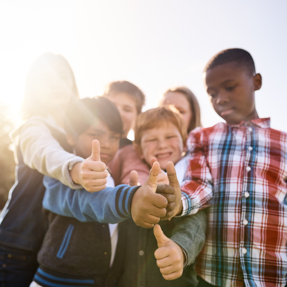 Photo of a group of children in the sun