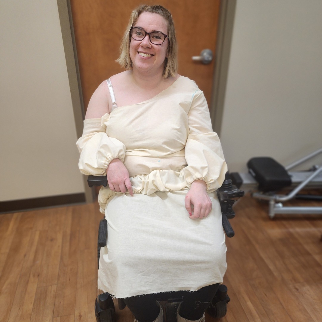 Emily smiles while wearing the muslim version of her formal dress
